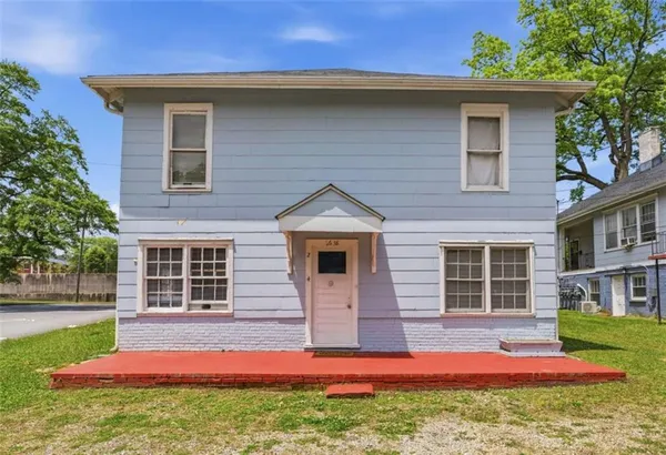 a front view of a house with yard