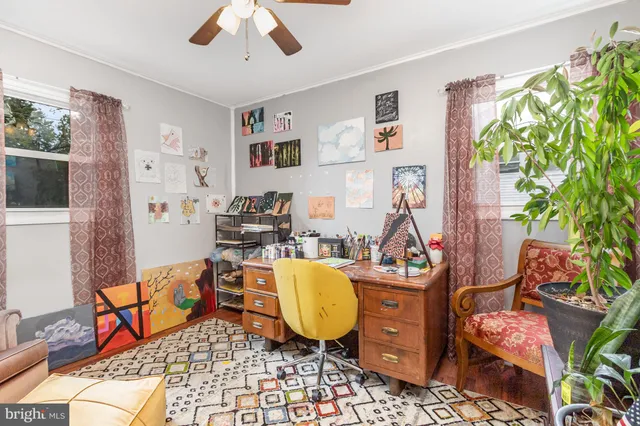 a living room with furniture and a rug