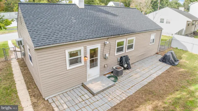 a backyard of a house with seating space