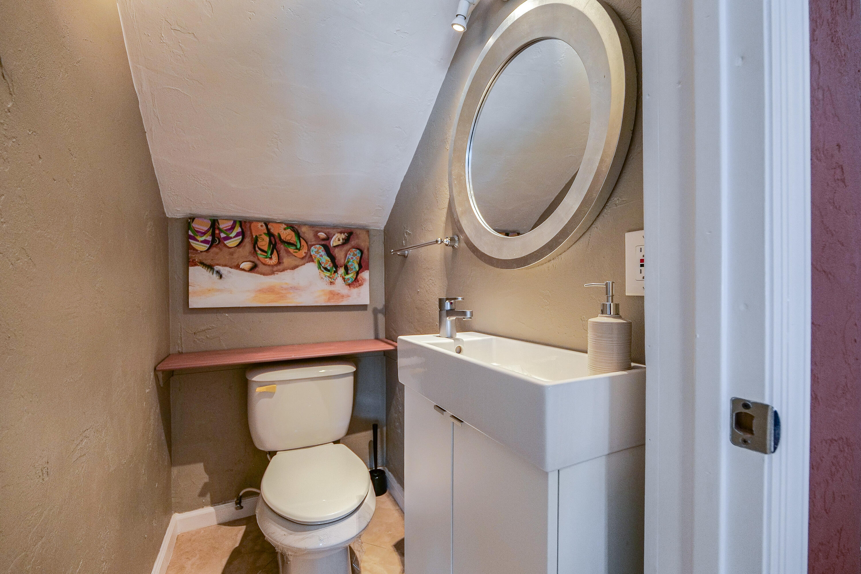 3425 Lime Hill Road, Unit 169 Lauderhill, FL 33319 - Photo 18 of 51 a bathroom with a toilet and a sink