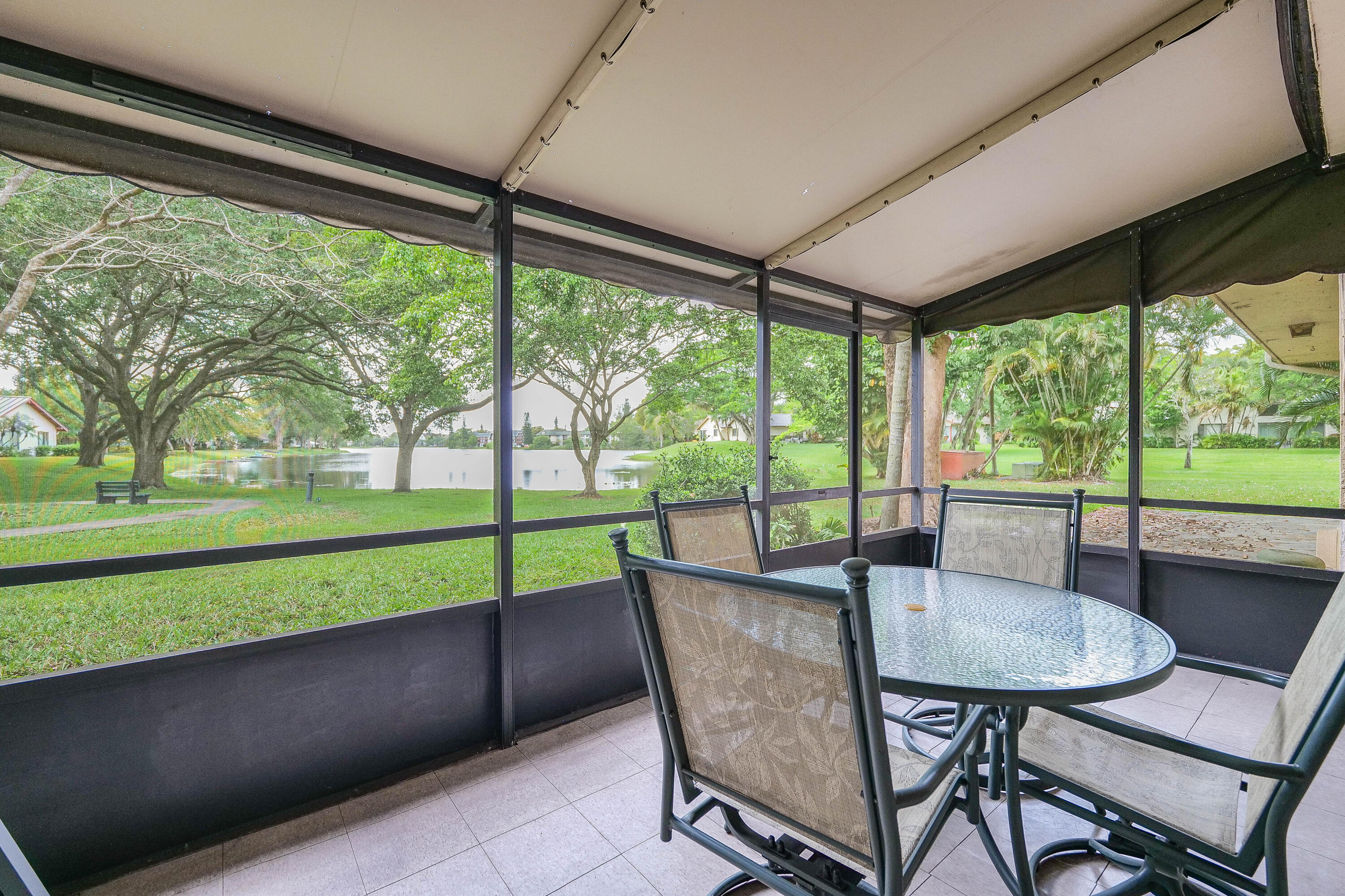 3425 Lime Hill Road, Unit 169 Lauderhill, FL 33319 - Photo 2 of 51 a dining room with furniture and a backyard