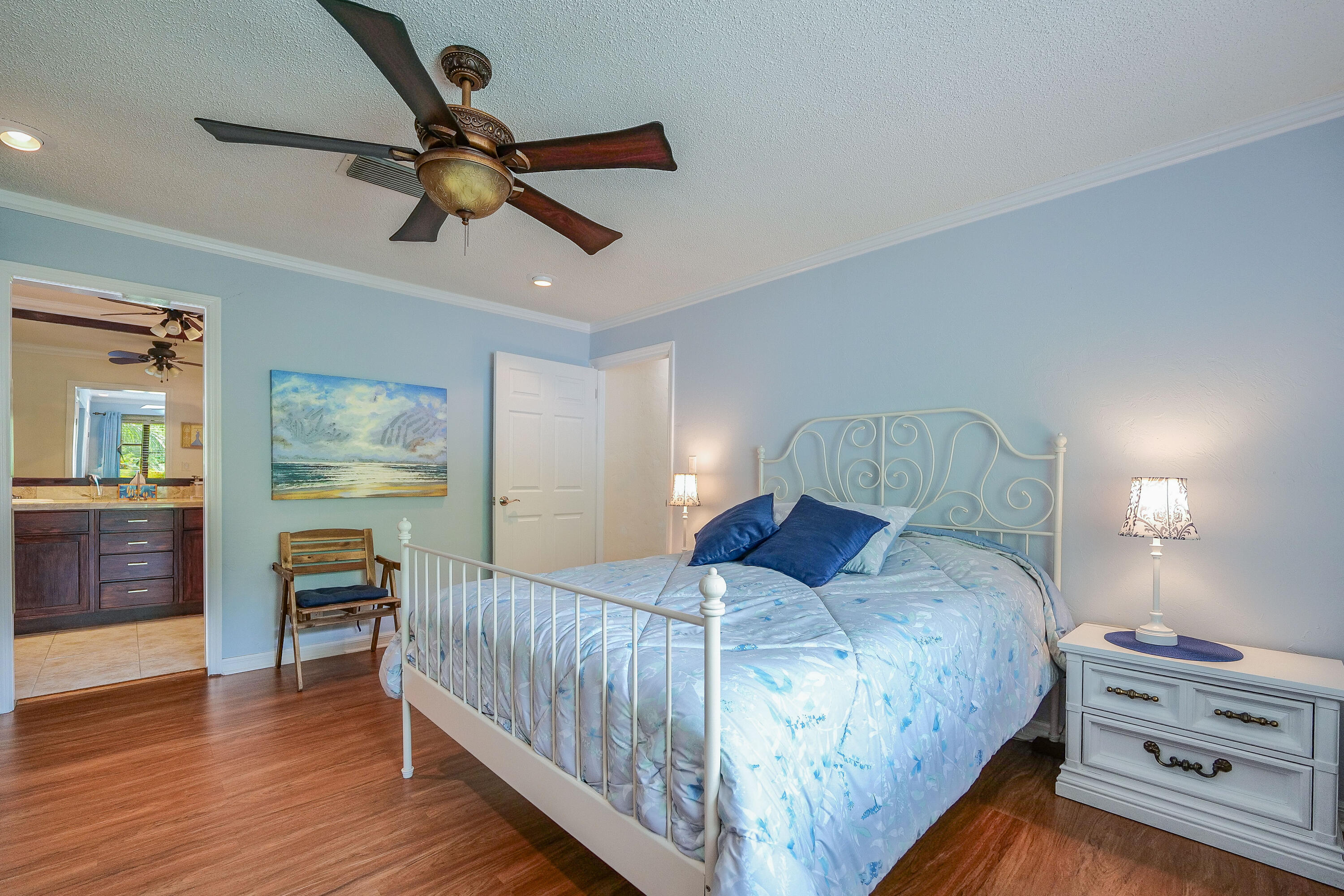 3425 Lime Hill Road, Unit 169 Lauderhill, FL 33319 - Photo 25 of 51 a bedroom with a bed and a chandelier