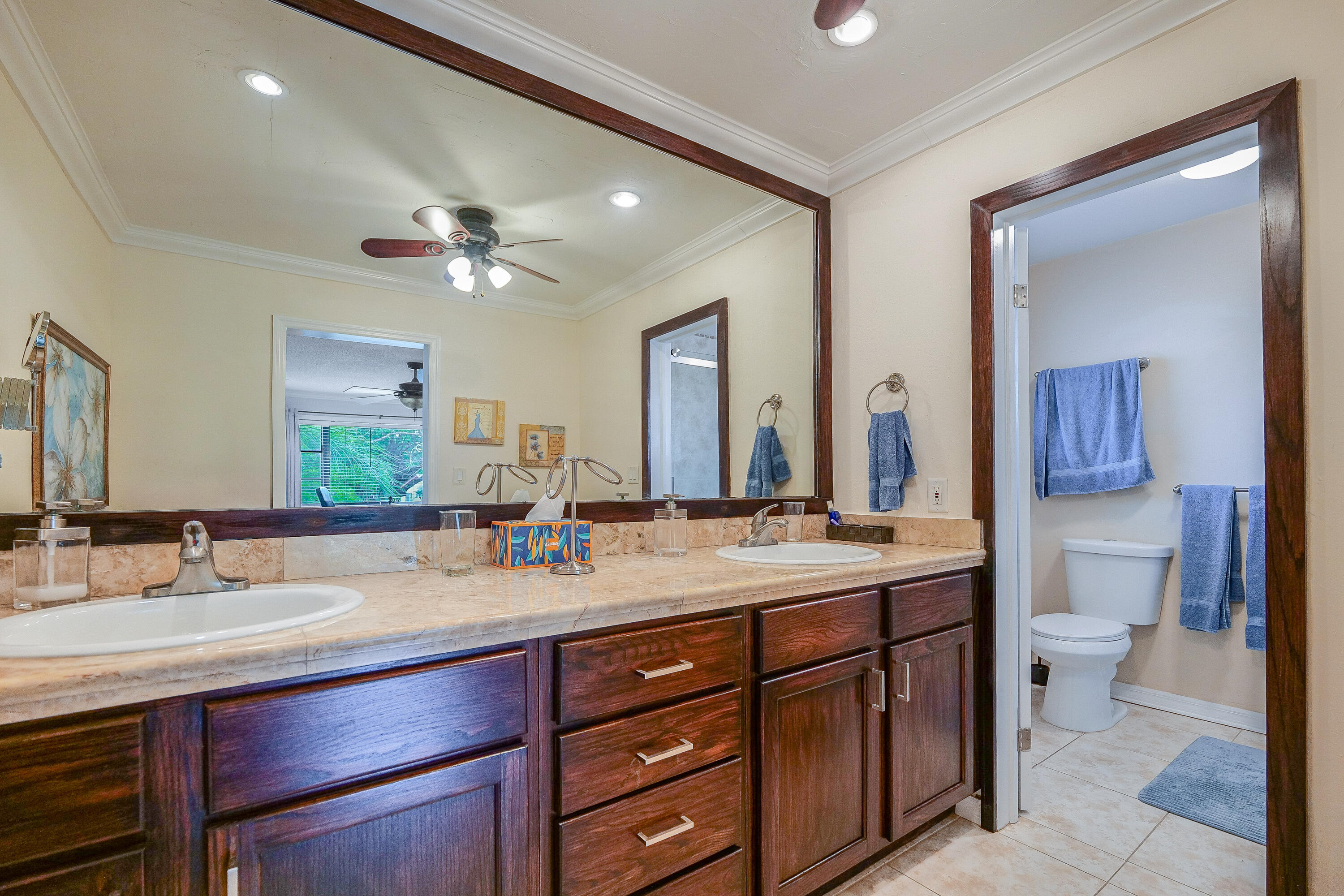 3425 Lime Hill Road, Unit 169 Lauderhill, FL 33319 - Photo 26 of 51 a bathroom with a sink vanity and a mirror