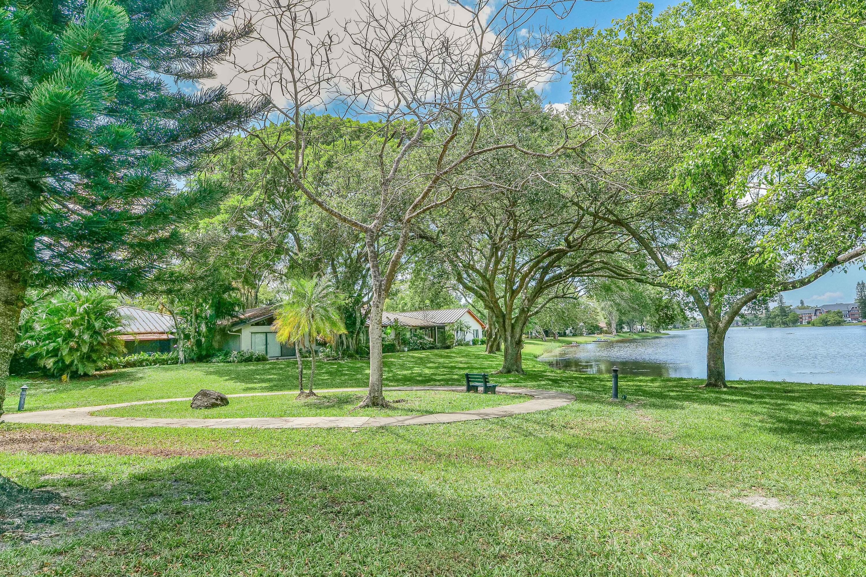 3425 Lime Hill Road, Unit 169 Lauderhill, FL 33319 - Photo 32 of 51 a view of a park with large trees