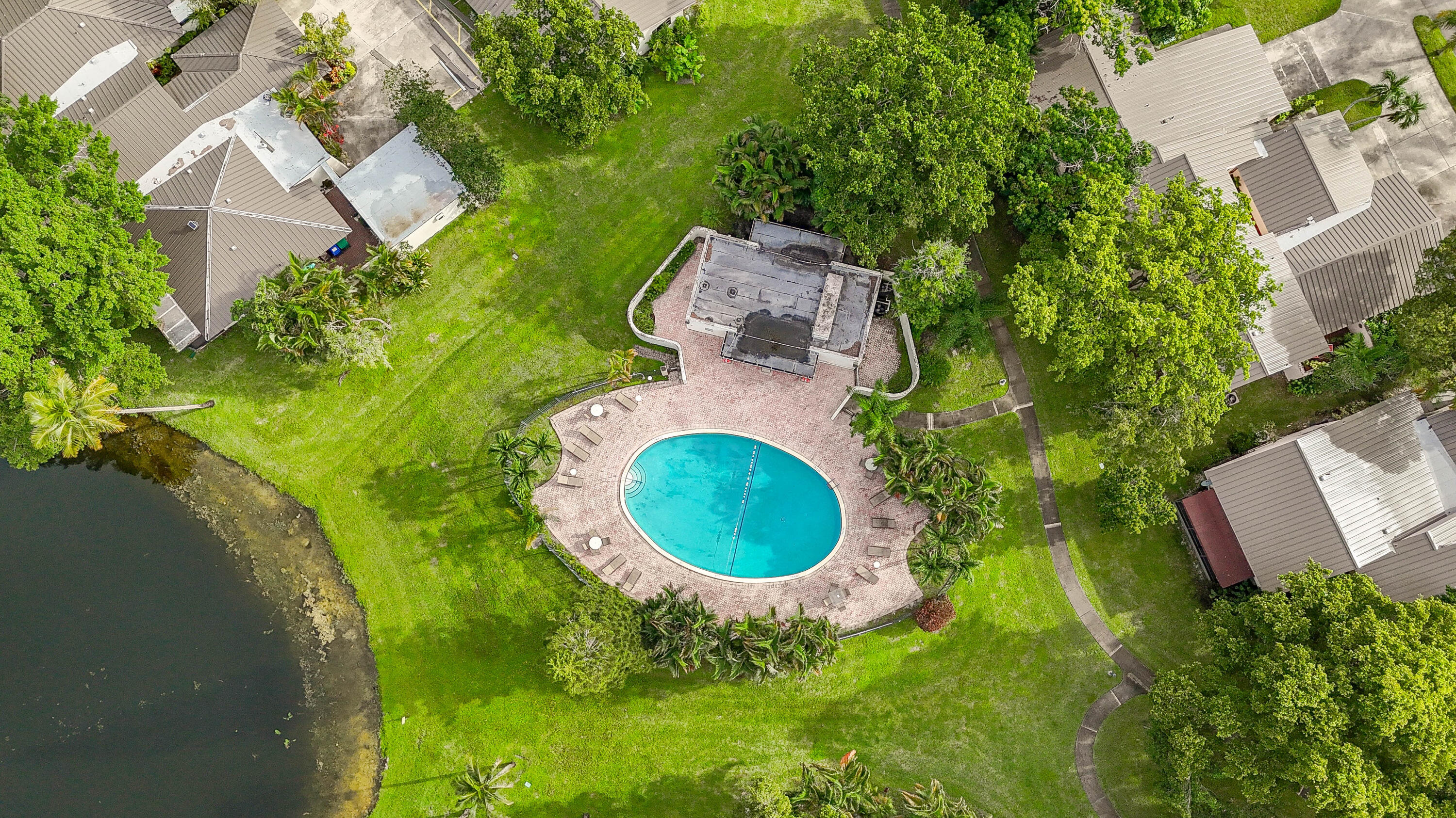 3425 Lime Hill Road, Unit 169 Lauderhill, FL 33319 - Photo 44 of 51 an aerial view of a house with pool garden and outdoor seating
