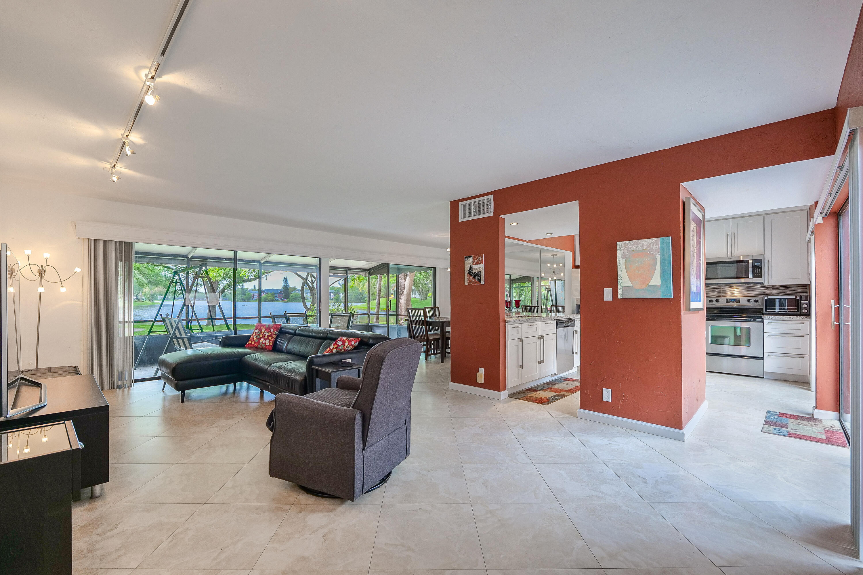 3425 Lime Hill Road, Unit 169 Lauderhill, FL 33319 - Photo 5 of 51 a living room with furniture and large windows