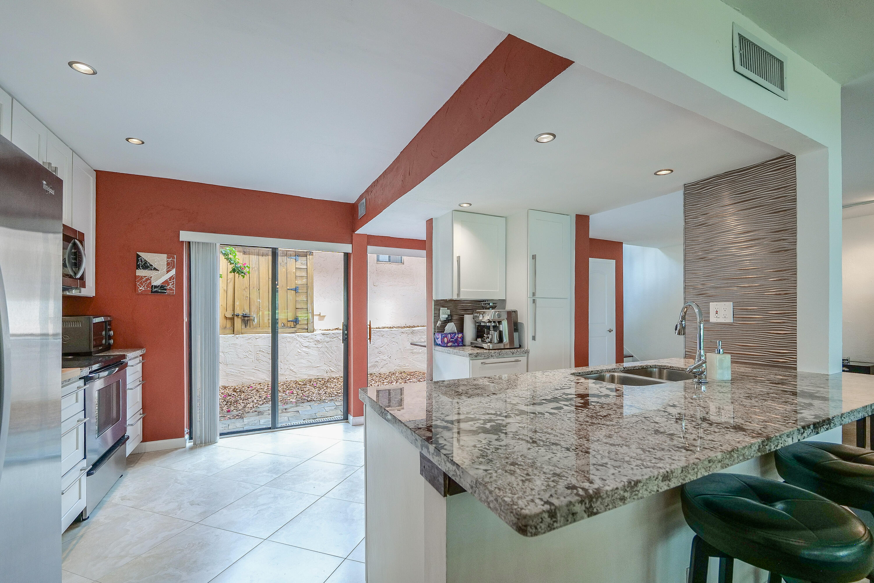 3425 Lime Hill Road, Unit 169 Lauderhill, FL 33319 - Photo 9 of 51 a bathroom with sinks granite countertop a sink and a large mirror