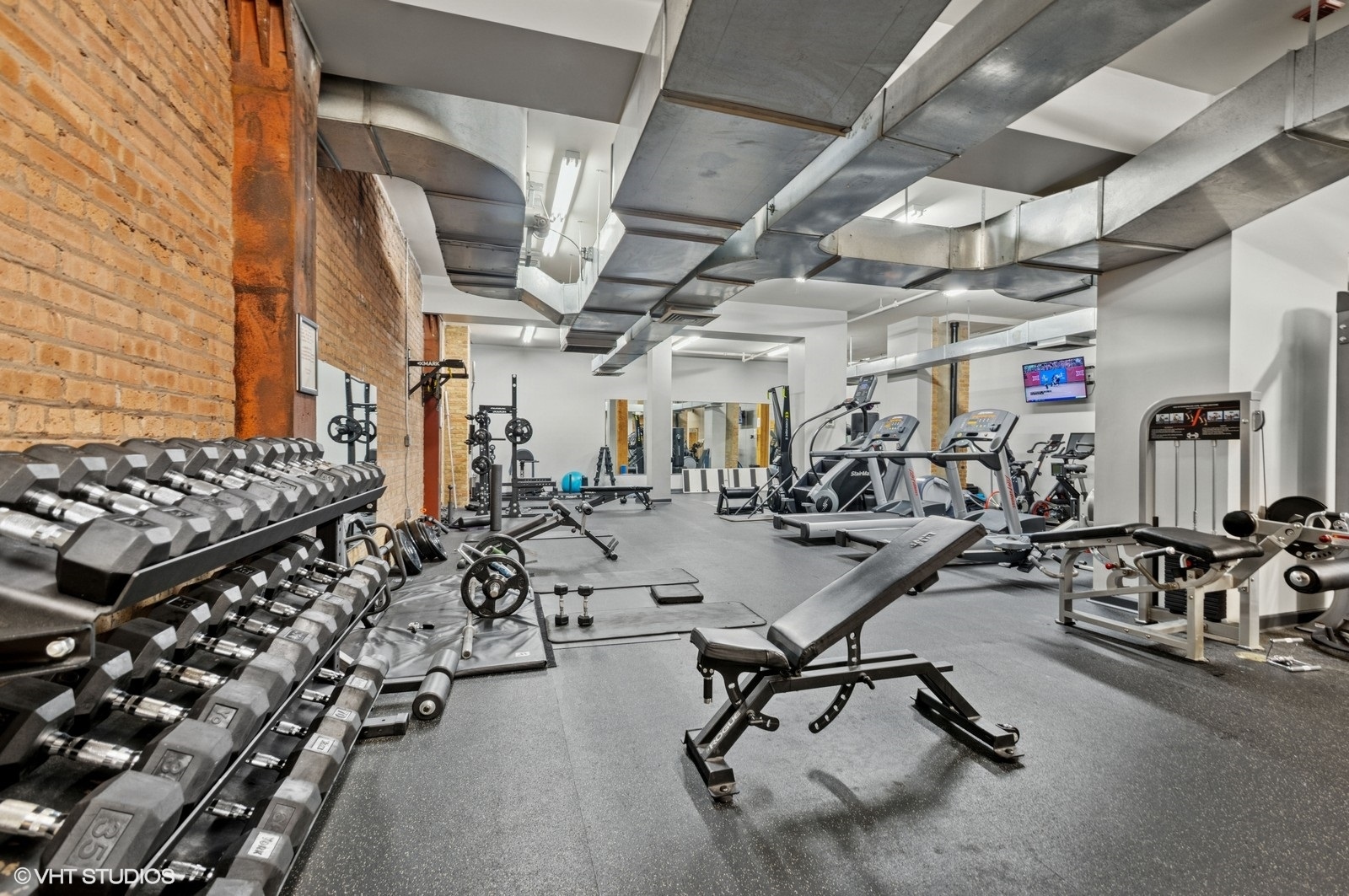 520 West Huron Street, Unit 109 Chicago, IL 60654 - Photo 12 of 14 a view of a room with gym equipment