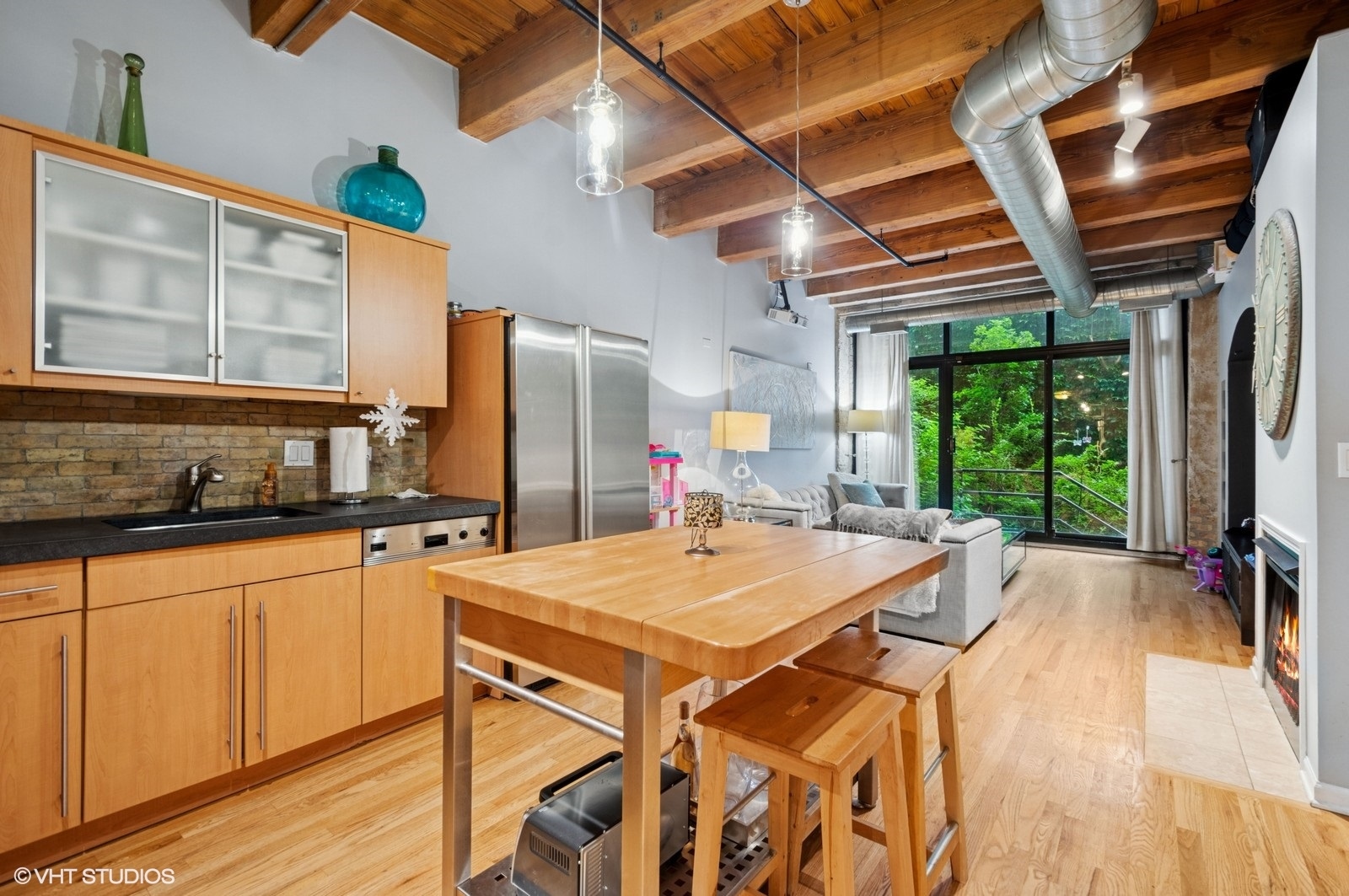 520 West Huron Street, Unit 109 Chicago, IL 60654 - Photo 4 of 14 a kitchen with a stove a refrigerator and wooden floor