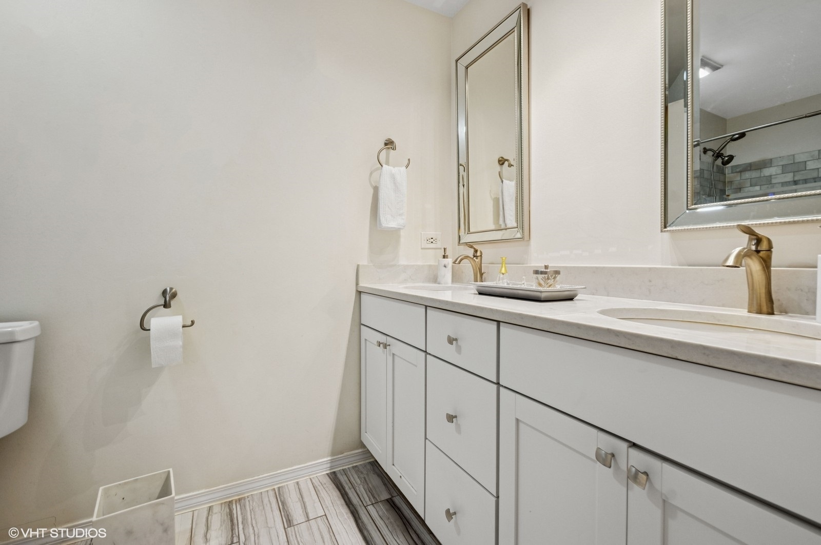 520 West Huron Street, Unit 109 Chicago, IL 60654 - Photo 8 of 14 a bathroom with a sink and a mirror