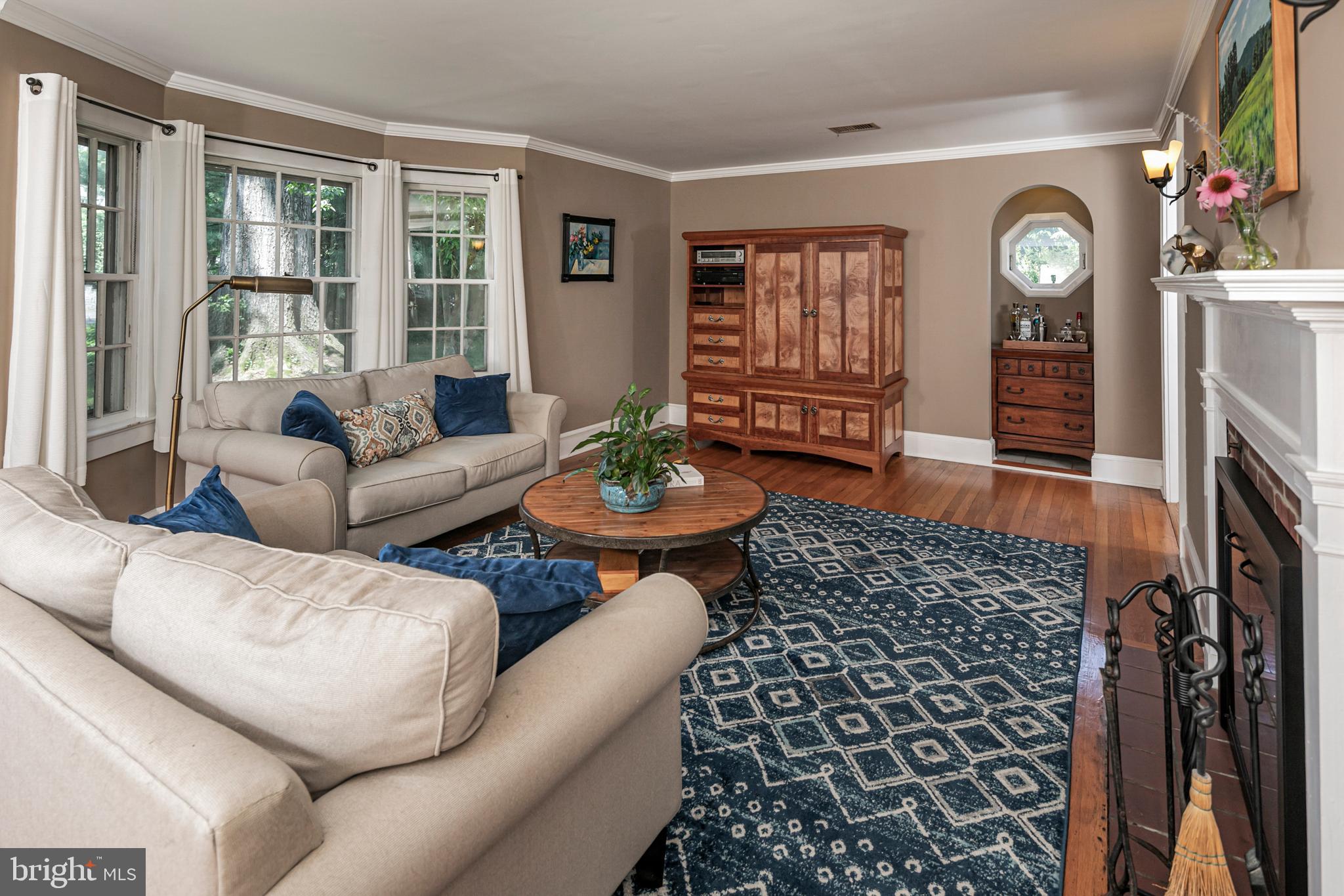 18 Mercer Street Hopewell, NJ 08525 - Photo 12 of 64 a living room with furniture a fireplace and a table