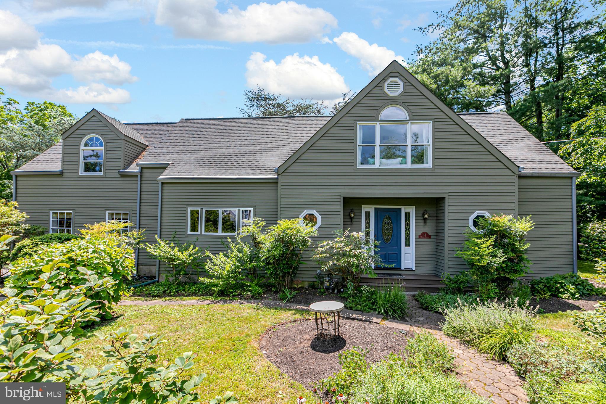 18 Mercer Street Hopewell, NJ 08525 - Photo 2 of 64 a front view of a house with a yard and potted plants