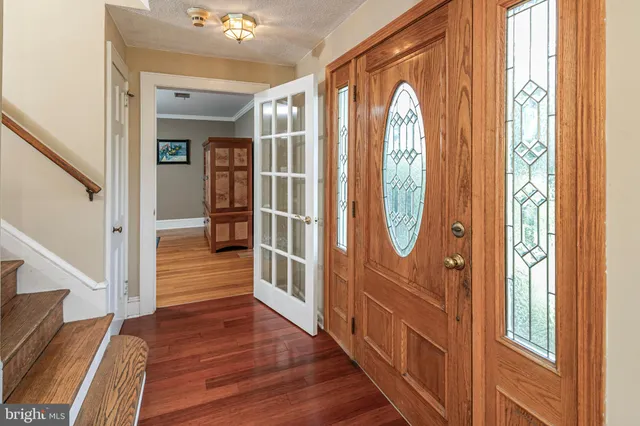 a view of entryway with wooden floor