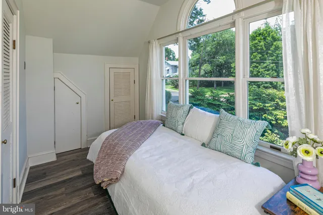 a view of yard with swimming pool and seating space