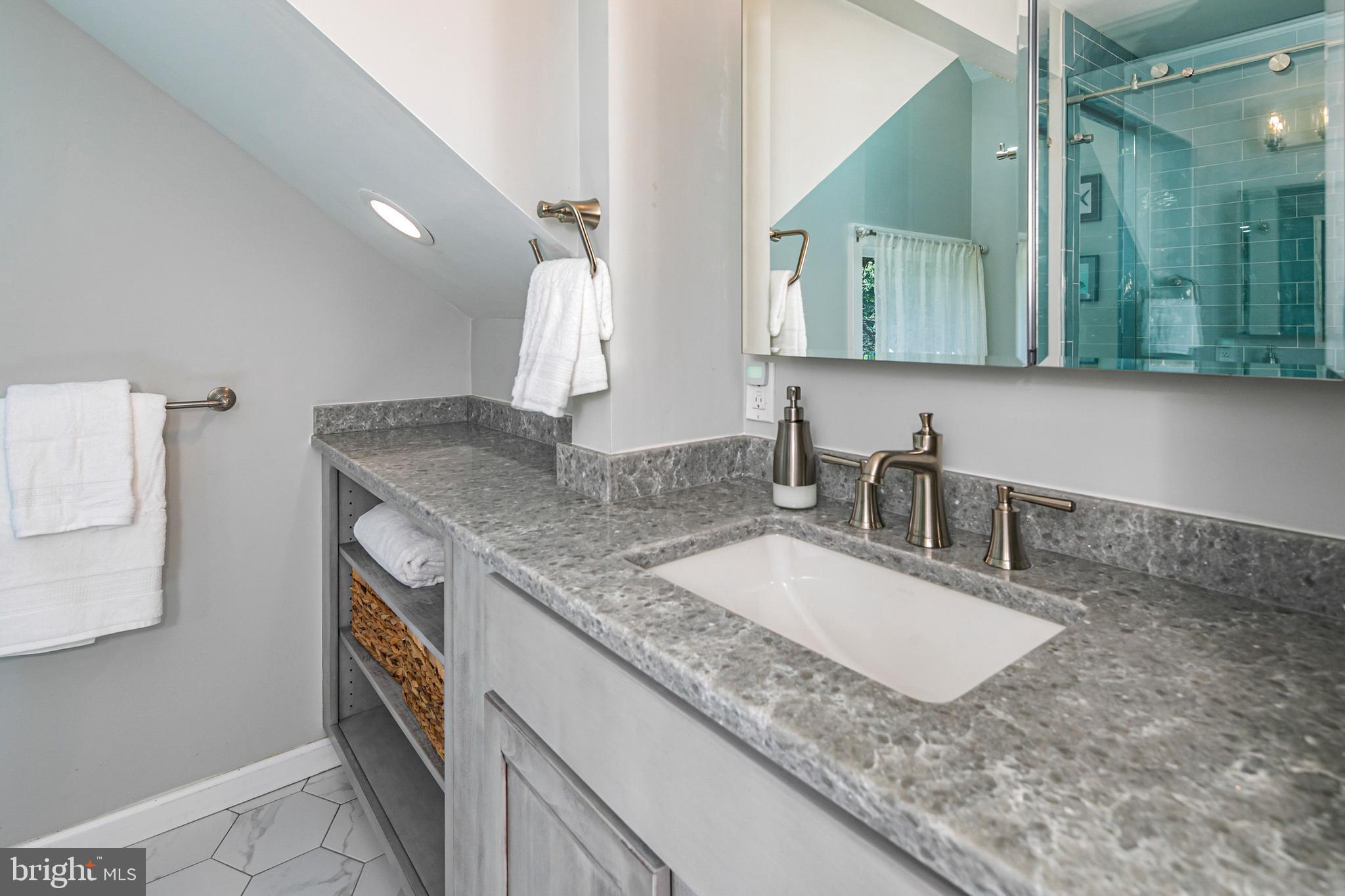 18 Mercer Street Hopewell, NJ 08525 - Photo 50 of 64 a bathroom with a granite countertop sink and a mirror