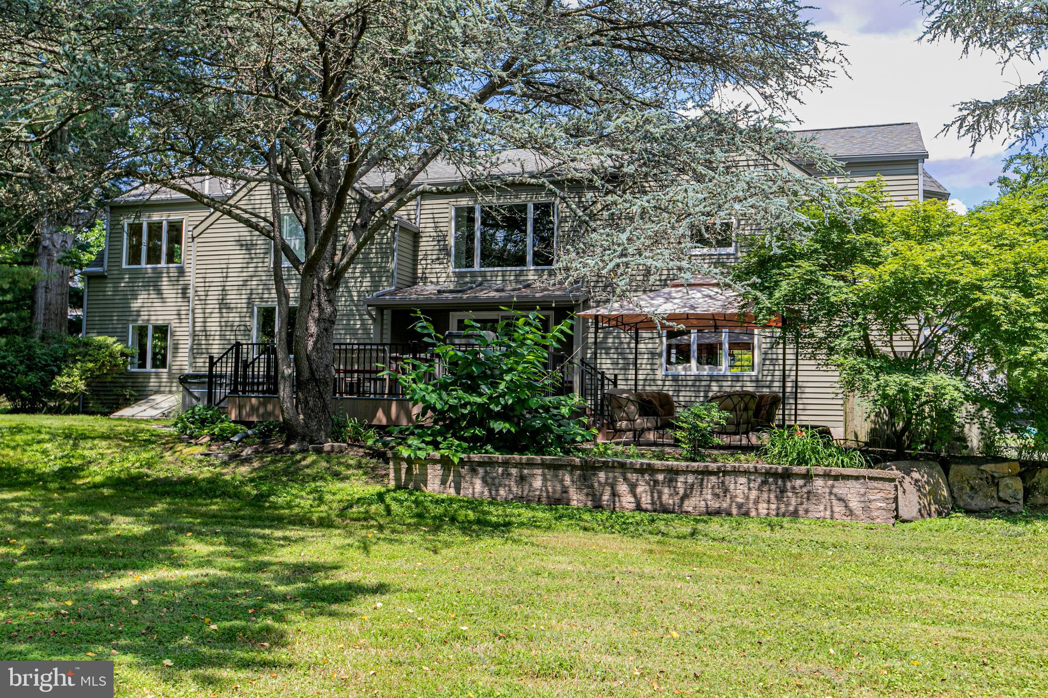 18 Mercer Street Hopewell, NJ 08525 - Photo 60 of 64 a view of a house with a yard table and chairs