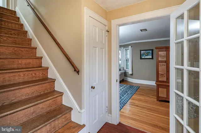 a living room with furniture a fireplace and a table