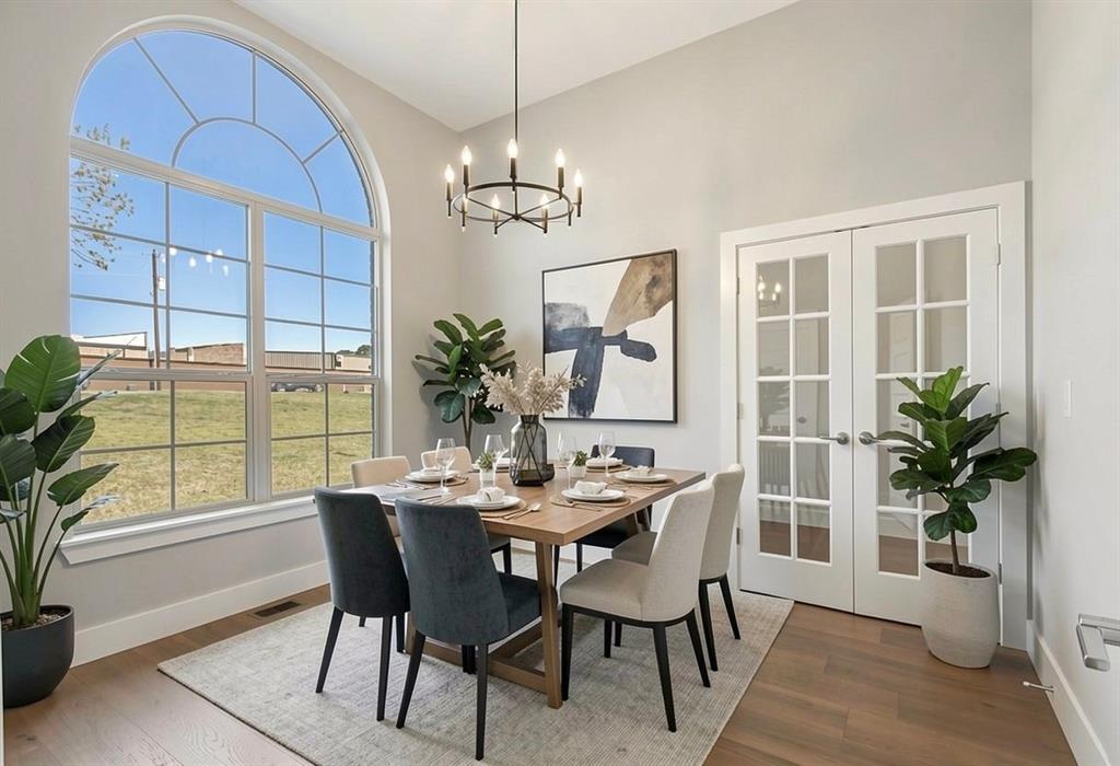 108 Winding Way Azle, TX 76020 - Photo 13 of 39 Dining space with french doors, wood finished floors, and hanging lights