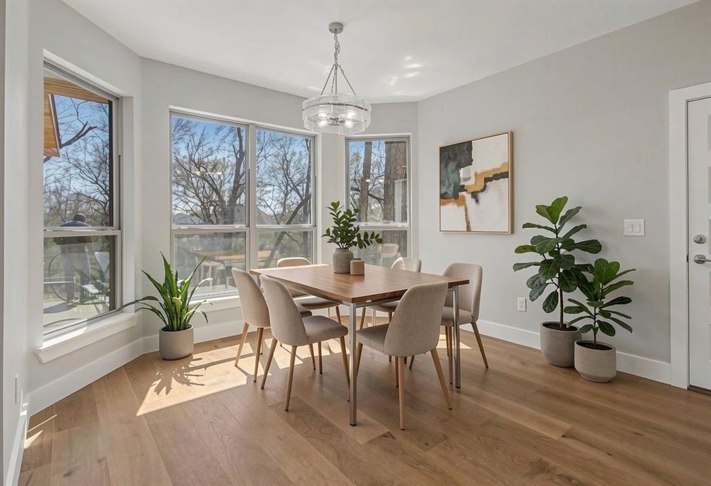 108 Winding Way Azle, TX 76020 - Photo 14 of 39 Dining area featuring light wood-style floors and suspended lighting