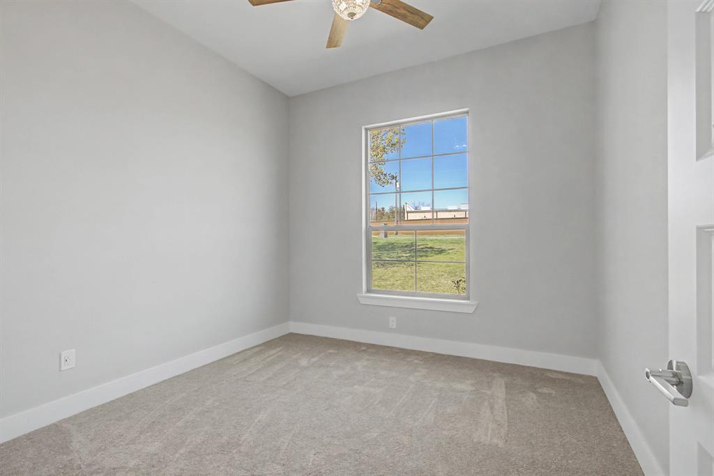 108 Winding Way Azle, TX 76020 - Photo 19 of 39 Spare room featuring light colored carpet and a ceiling fan