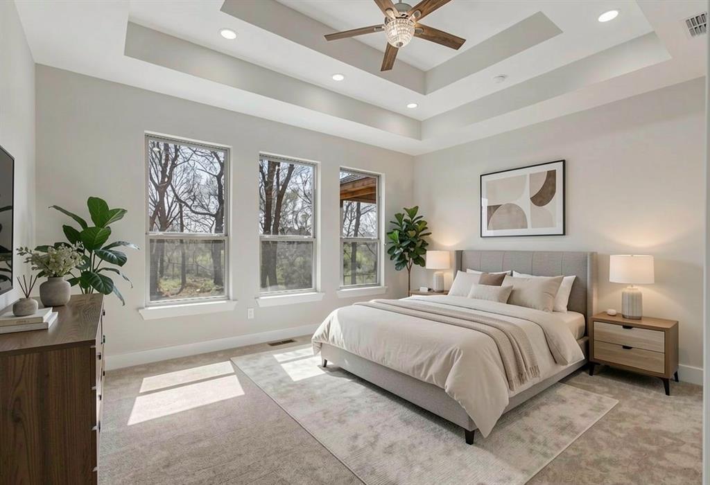 108 Winding Way Azle, TX 76020 - Photo 22 of 39 Bedroom with light colored carpet, ceiling fan, recessed lighting, and a tray ceiling