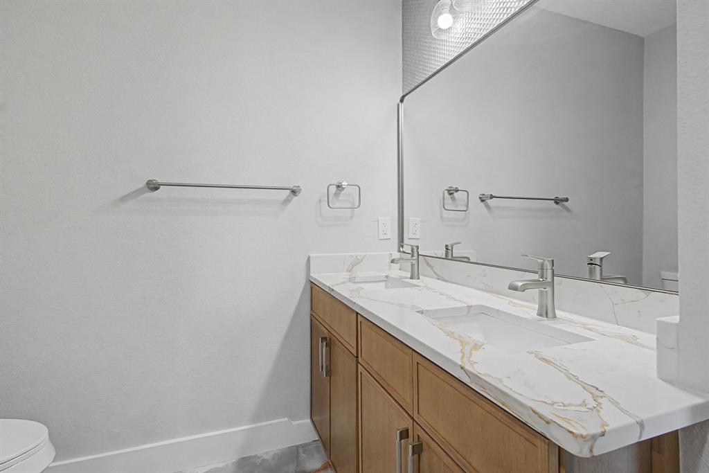 108 Winding Way Azle, TX 76020 - Photo 32 of 39 Bathroom featuring toilet and double vanity