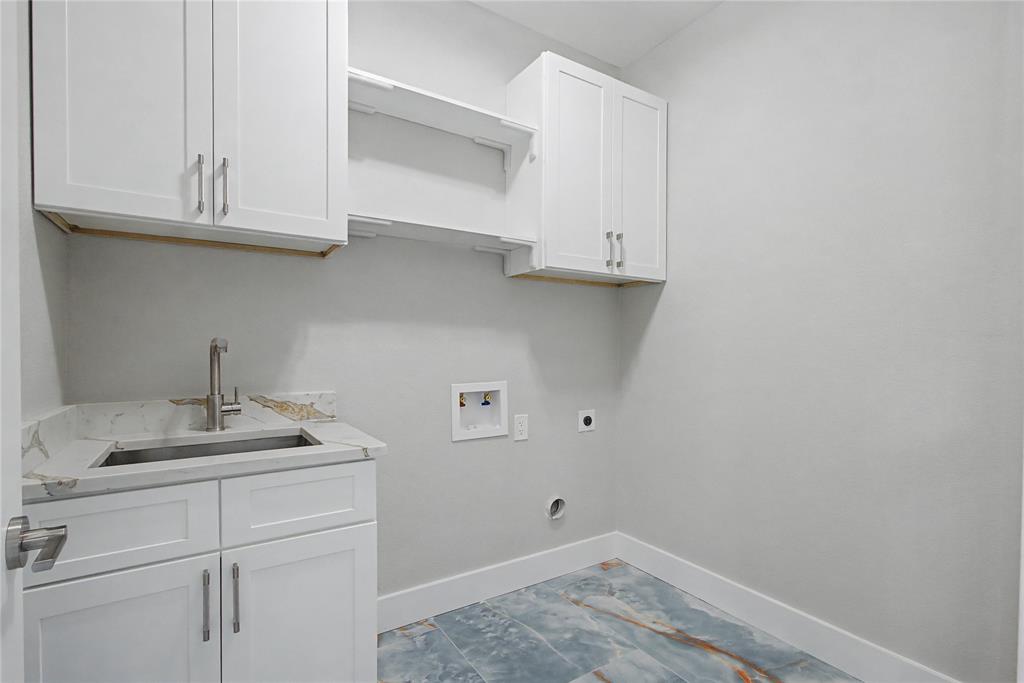 108 Winding Way Azle, TX 76020 - Photo 33 of 39 Laundry room featuring hookup for an electric dryer, washer hookup, and cabinet space