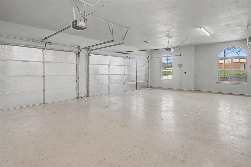 108 Winding Way Azle, TX 76020 - Photo 34 of 39 Garage with a garage door opener