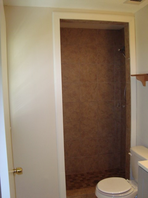8224 Bryn Mawr Lane Columbus, GA 31904 - Photo 16 of 19 a white toilet sitting next to a shower