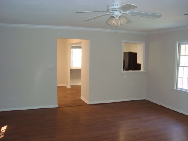 8224 Bryn Mawr Lane Columbus, GA 31904 - Photo 3 of 19 an empty room with windows and fan