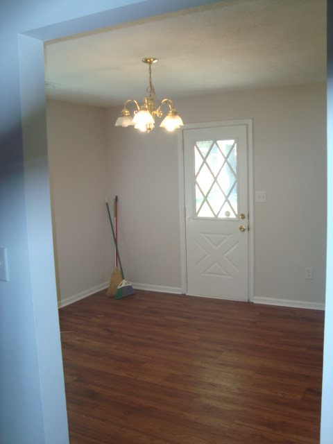 8224 Bryn Mawr Lane Columbus, GA 31904 - Photo 4 of 19 wooden floor in an empty room with a window