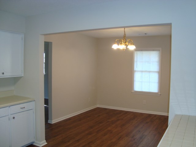 8224 Bryn Mawr Lane Columbus, GA 31904 - Photo 5 of 19 an empty room with wooden floor and windows