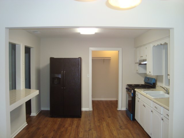 8224 Bryn Mawr Lane Columbus, GA 31904 - Photo 6 of 19 a kitchen with granite countertop a refrigerator and a sink