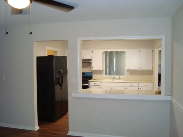 a view of kitchen with wooden floor
