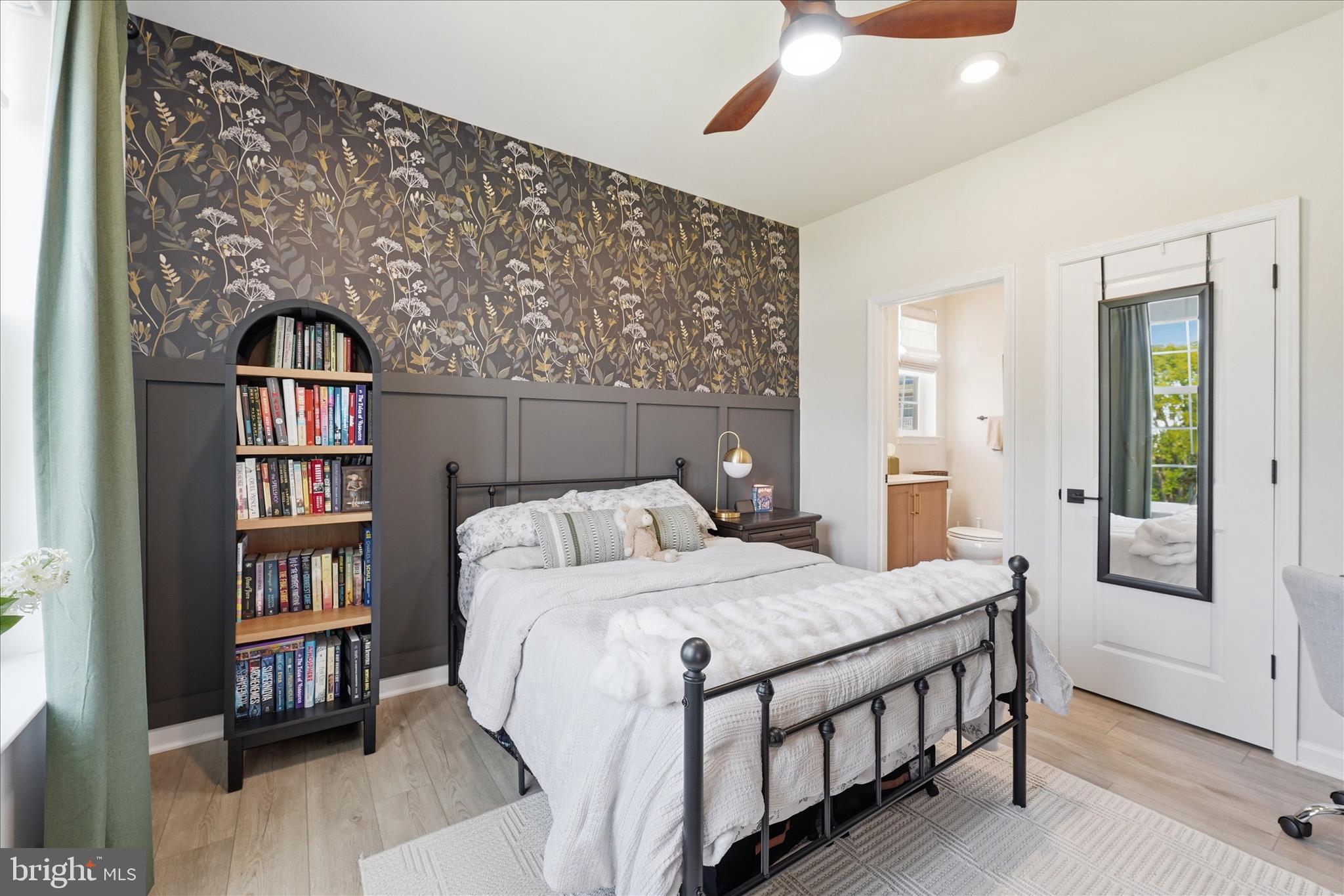 910 Enfield Farm Lane Brunswick, MD 21716 - Photo 26 of 87 a bedroom with a bed and a book shelf