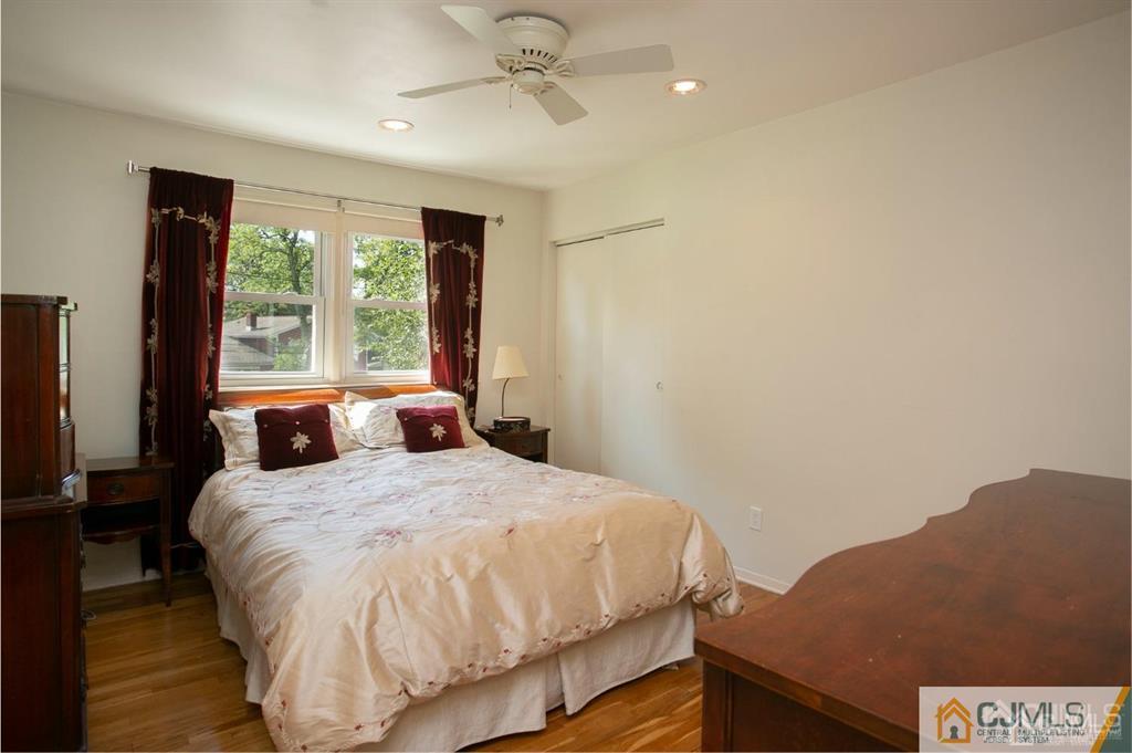 7 Douglas Drive Edison, NJ 08817 - Photo 13 of 26 a bedroom with a bed and a large window