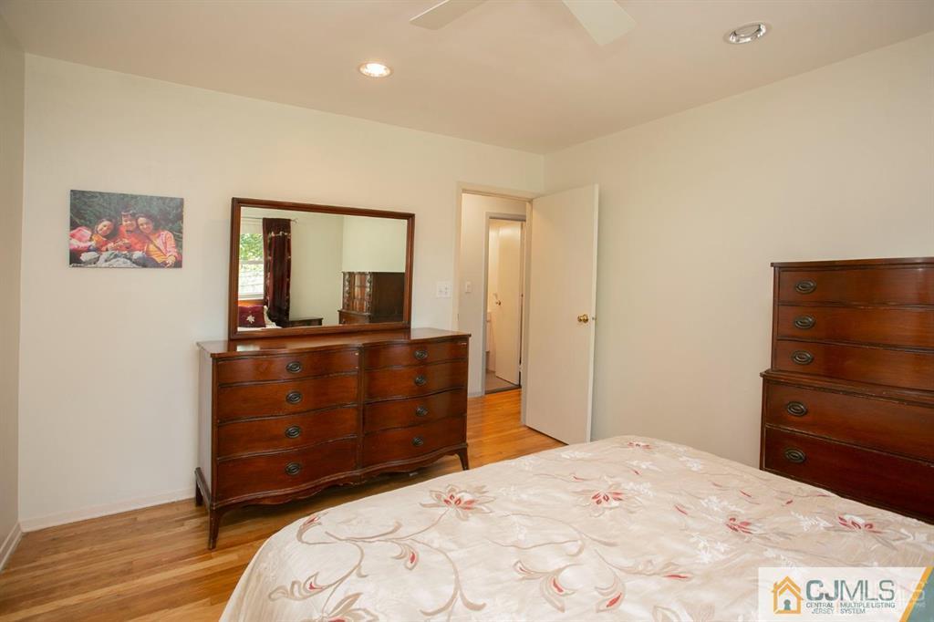 7 Douglas Drive Edison, NJ 08817 - Photo 14 of 26 a bedroom with a bed and a dresser
