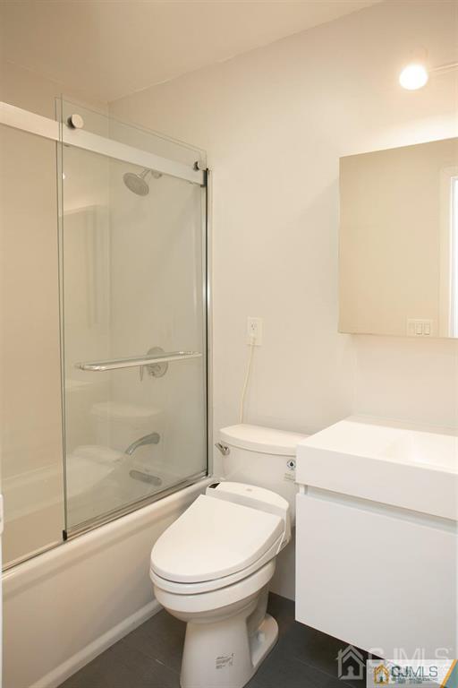 7 Douglas Drive Edison, NJ 08817 - Photo 20 of 26 a bathroom with a sink a toilet and shower