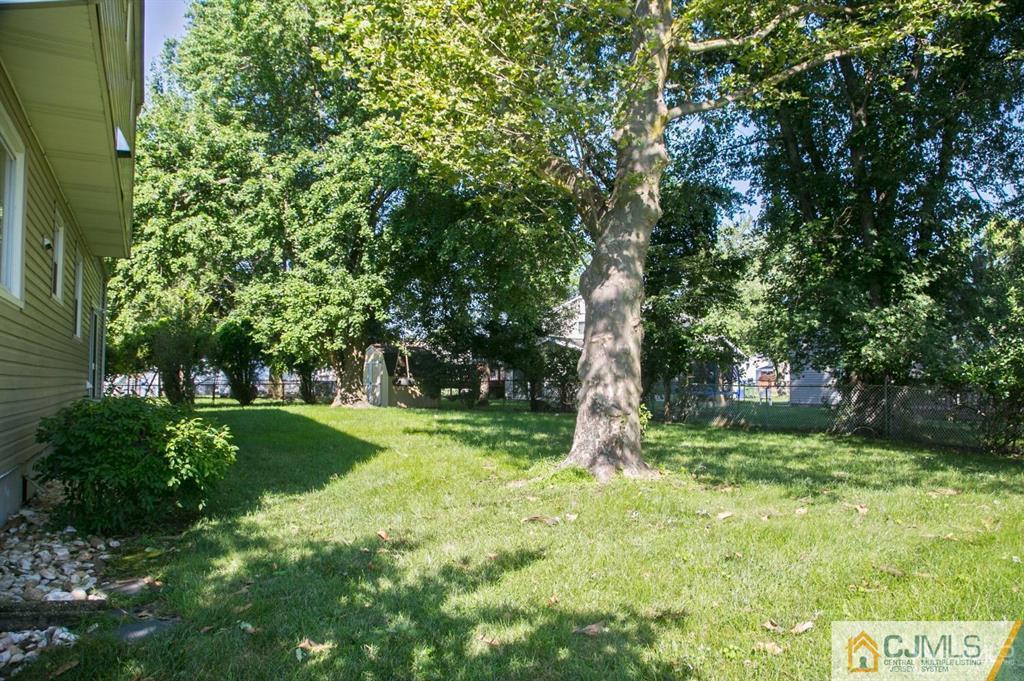 7 Douglas Drive Edison, NJ 08817 - Photo 25 of 26 a view of a backyard with large trees