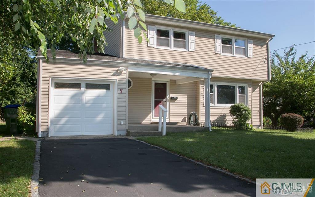 7 Douglas Drive Edison, NJ 08817 - Photo 26 of 26 a front view of a house with a yard