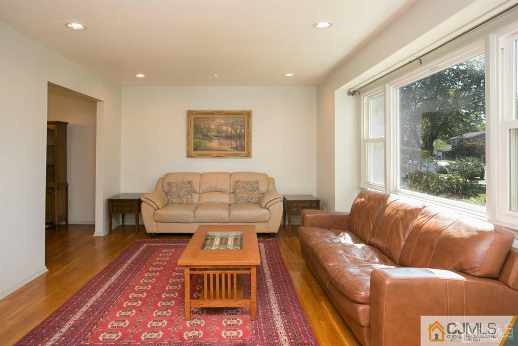 7 Douglas Drive Edison, NJ 08817 - Photo 3 of 26 a living room with furniture and a rug