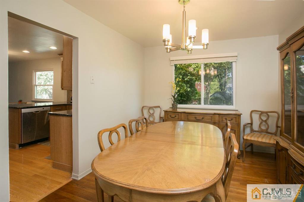 7 Douglas Drive Edison, NJ 08817 - Photo 5 of 26 a view of a dining room with furniture window and wooden floor