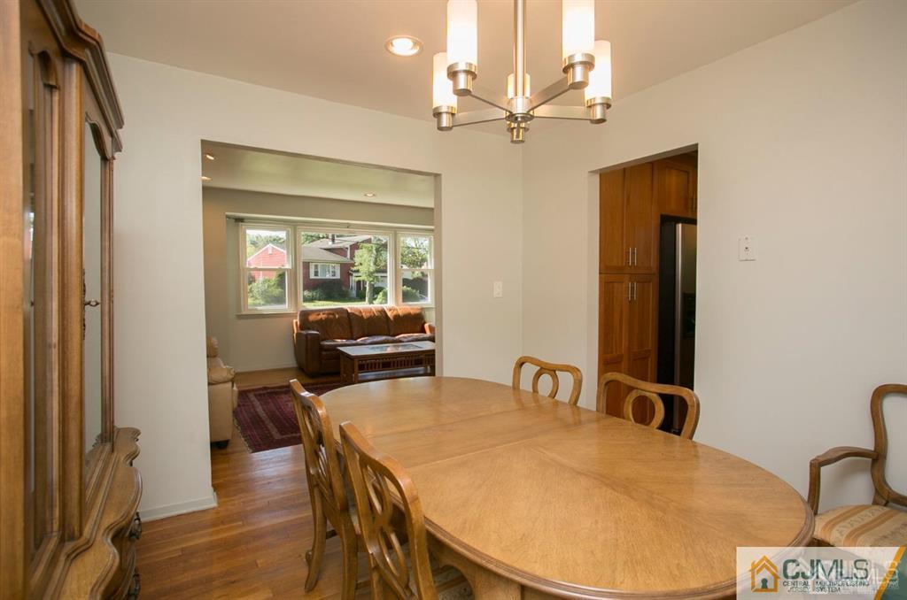 7 Douglas Drive Edison, NJ 08817 - Photo 6 of 26 a view of a dining room with furniture and wooden floor