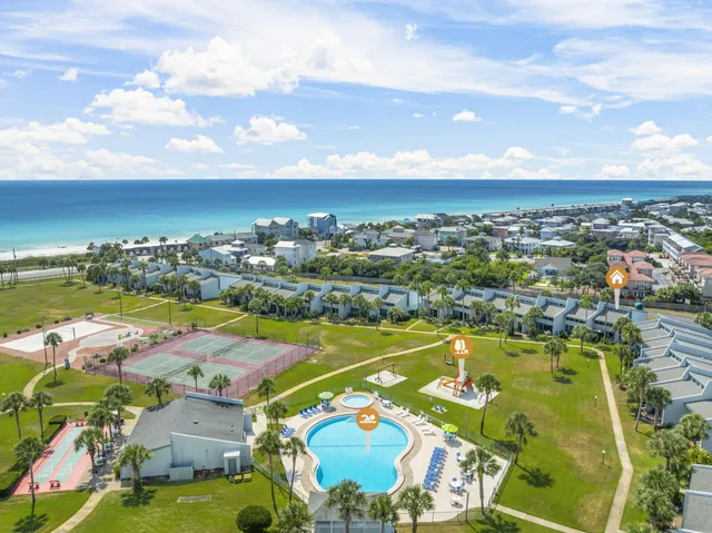 an aerial view of residential houses with outdoor space
