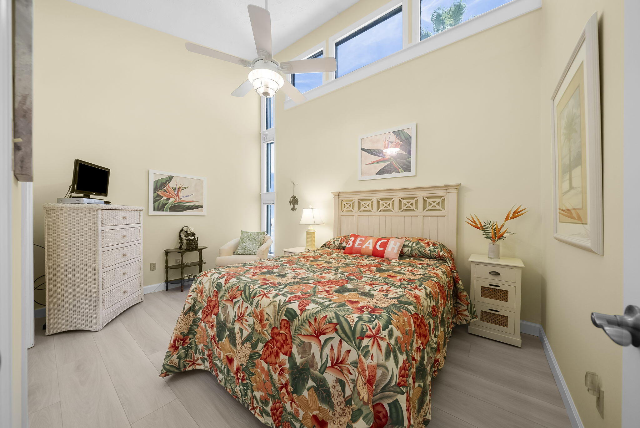 22400 Front Beach Road, Unit 24 Panama City Beach, FL 32413 - Photo 24 of 41 a bed sitting in a bedroom next to a window