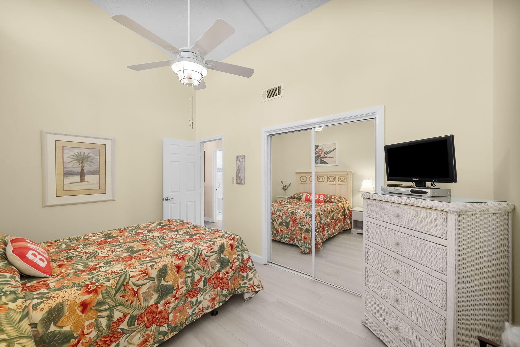 22400 Front Beach Road, Unit 24 Panama City Beach, FL 32413 - Photo 25 of 41 a bedroom with a bed and a flat screen tv