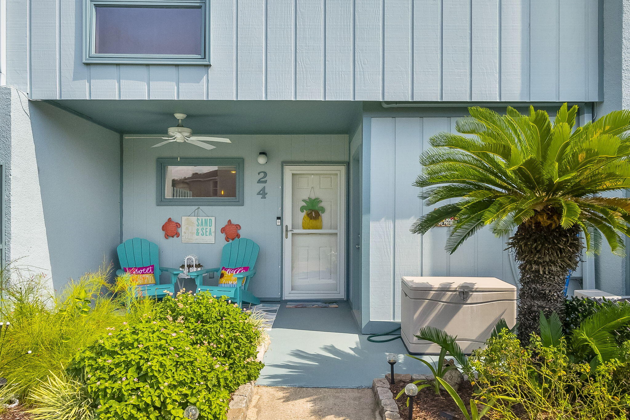 22400 Front Beach Road, Unit 24 Panama City Beach, FL 32413 - Photo 28 of 41 a sink with a dining table and with potted plants
