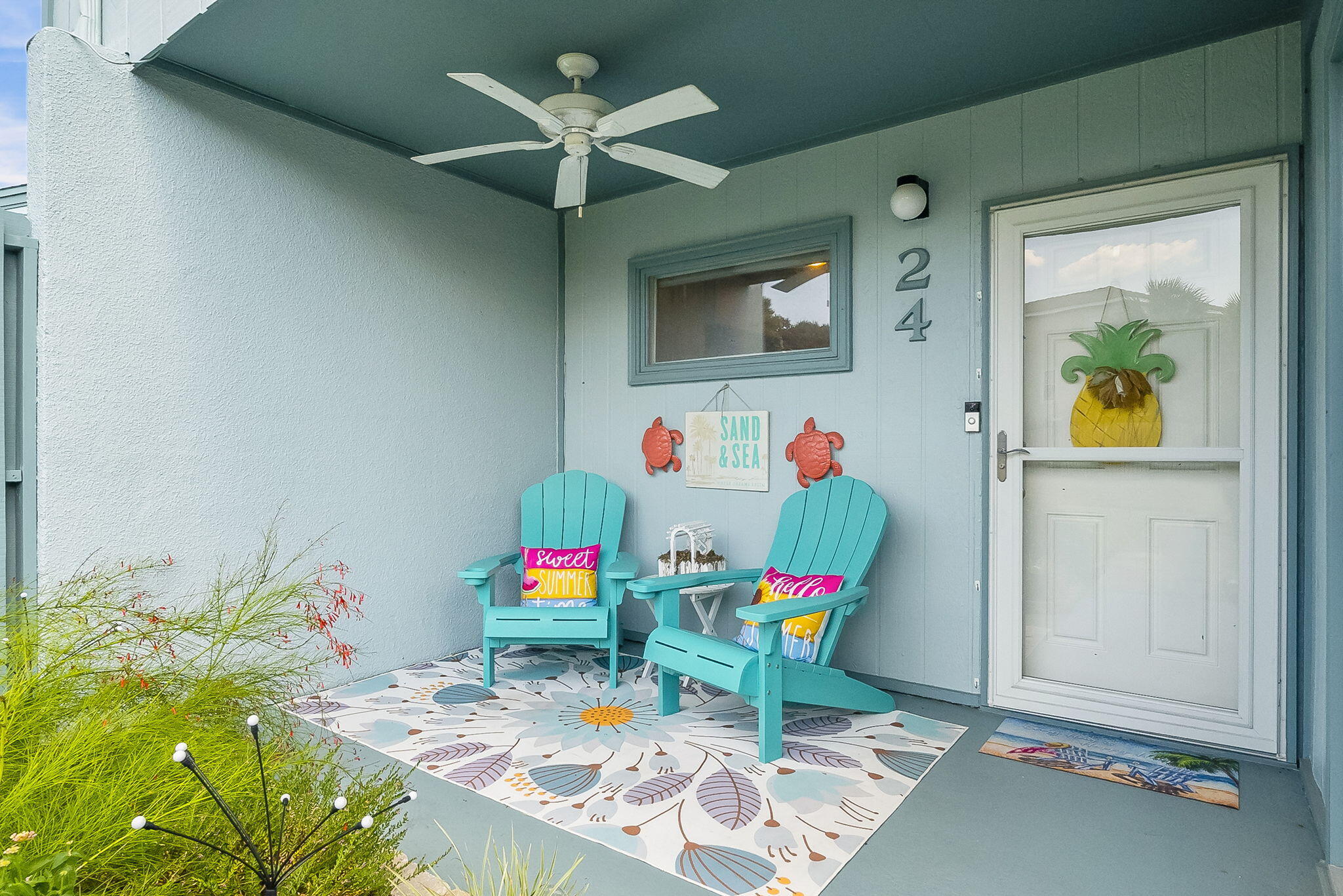 22400 Front Beach Road, Unit 24 Panama City Beach, FL 32413 - Photo 29 of 41 a living room with furniture and a table