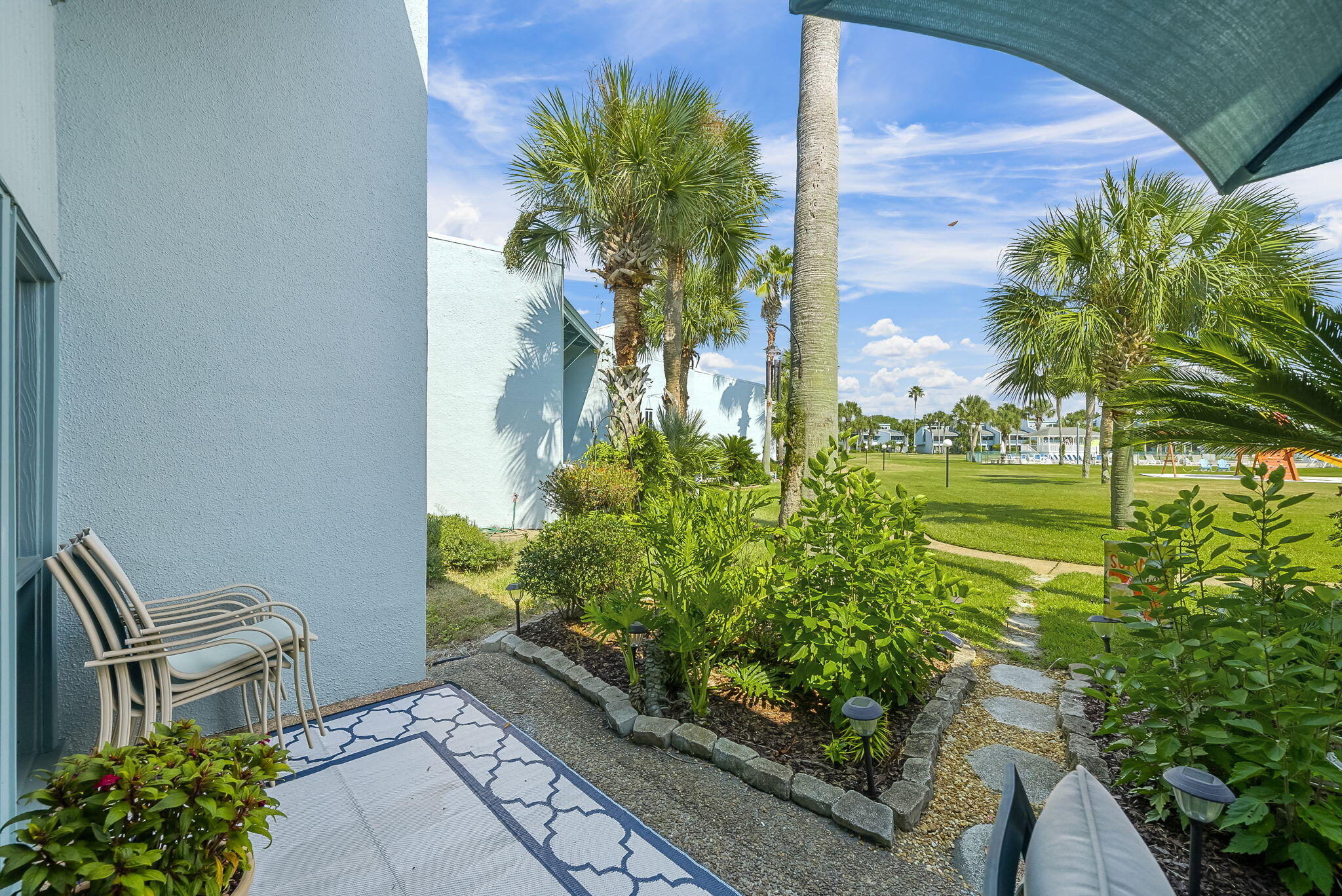 22400 Front Beach Road, Unit 24 Panama City Beach, FL 32413 - Photo 32 of 41 a view of a garden with plants