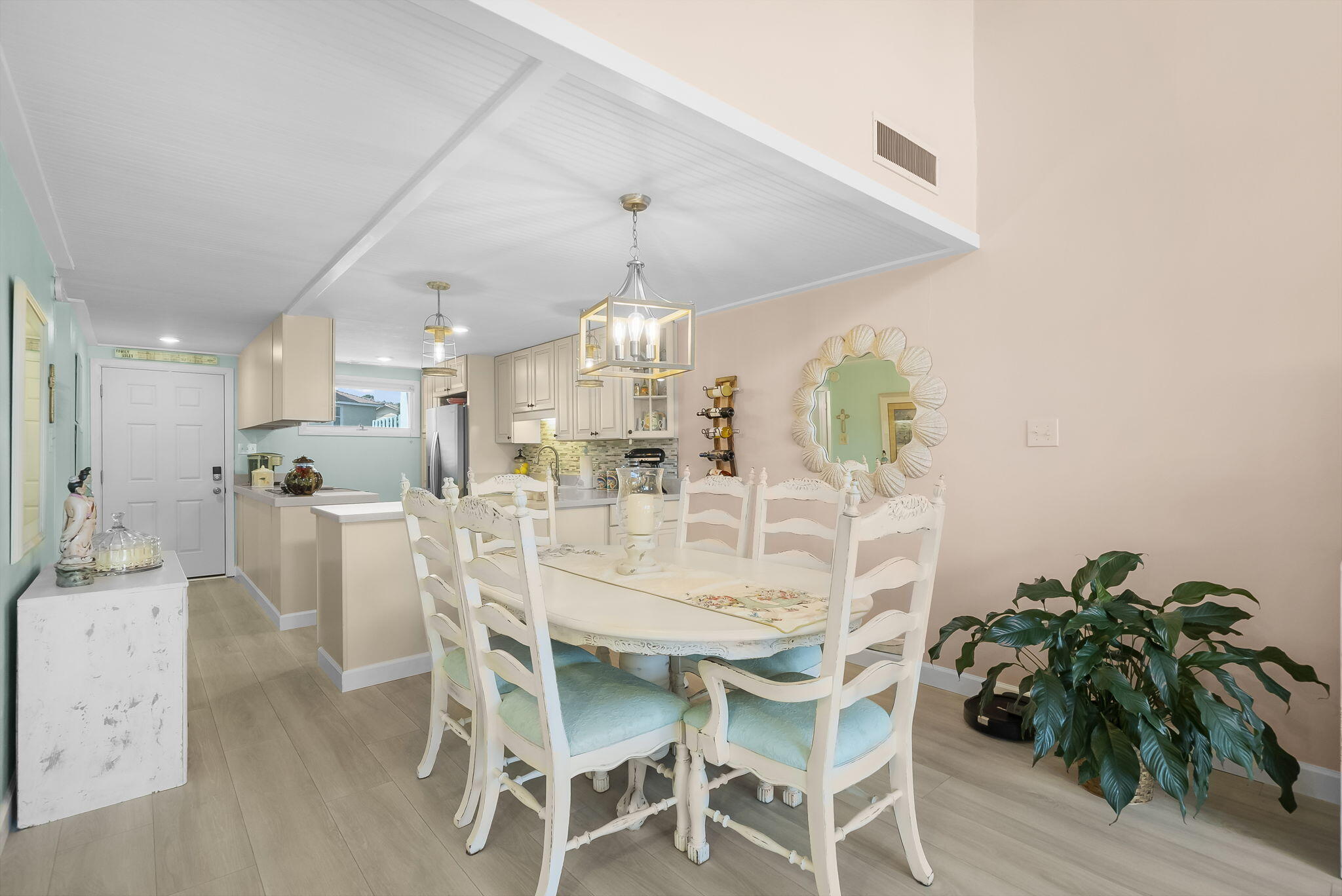 22400 Front Beach Road, Unit 24 Panama City Beach, FL 32413 - Photo 8 of 41 a view of a dining room with furniture and wooden floor